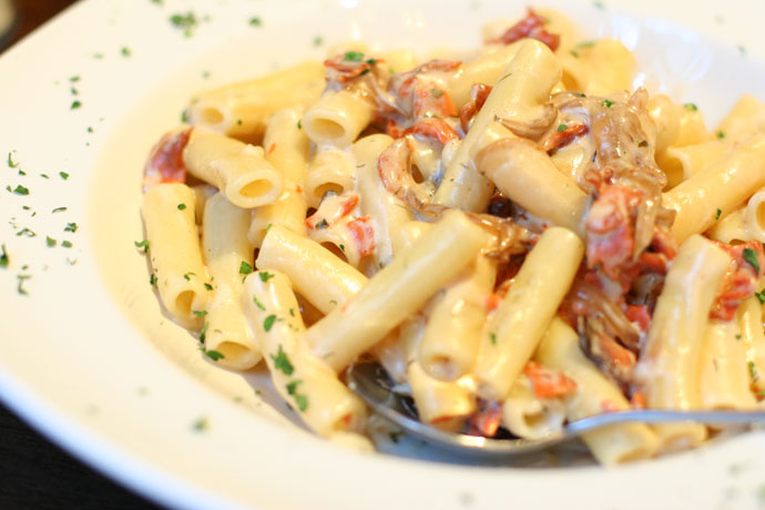 Italian pasta with salmon from Anduccis Pub restaurant in downtown Vancouver, BC, Canada.