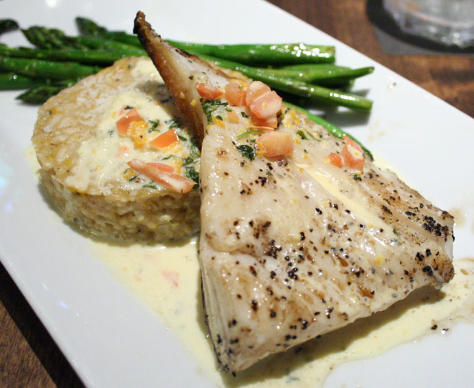 Pan Seared Halibut and Citrus Risotto Cake served with Asparagus