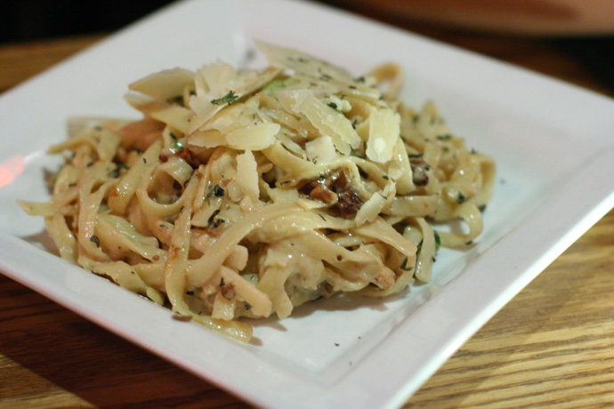 Carbonara fettuccini pasta from Capone's restaurant and Live Jazz Club in Vancouver BC Canada.