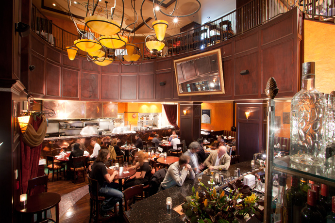 Dining room of Copper Chimney restaurant at the LeSoleil hotel in Vancouver BC Canada.