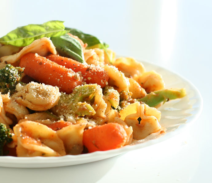 Beef tortellini pasta with fresh basil and white wine, and bolognaise meat sauce.