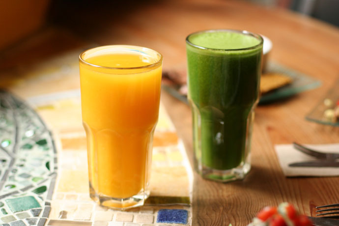 Fresh orange juice ($5.25) and Green Glory drink ($5.50) from Gorilla Foods in Vancouver.
