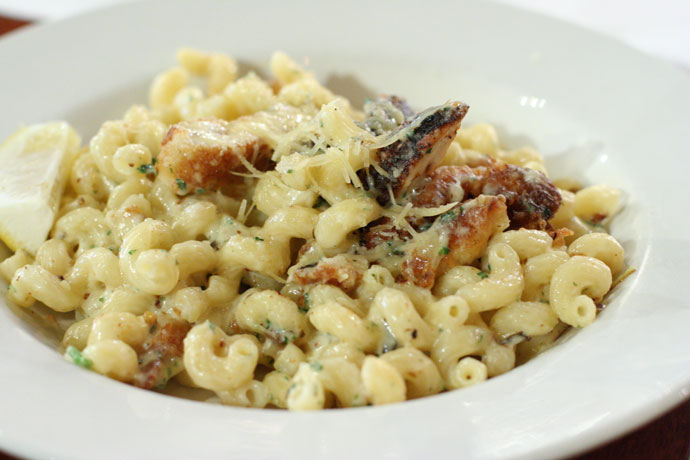 Pasta with breaded chicken breast and cheese.