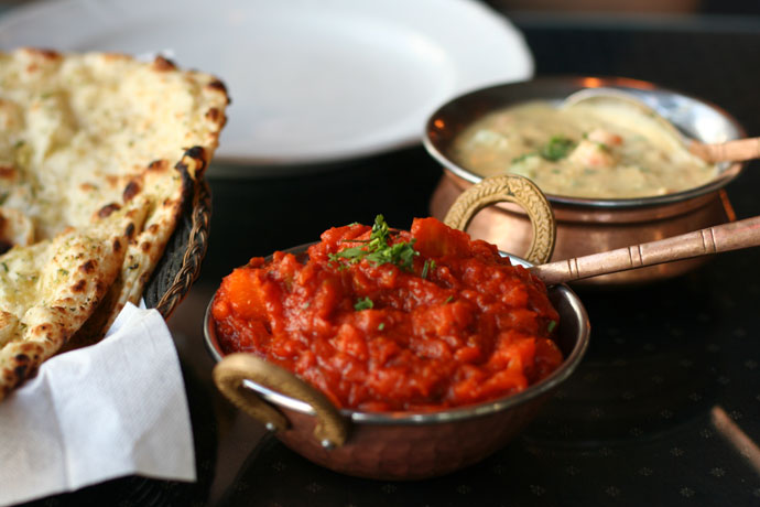 Indian food from Indian Oven restaurant in Vancouver: Garlic Naan bread ($2.25), Bombay Aloo ($10.95), Vegetable Korma ($10.95)