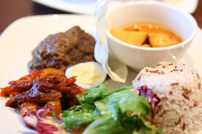 Nasi Jambori from Jonker Street Malaysian Restaurant - Sampler of chicken curry, beef rendang, prawn sambal on a platter with egg, side salad, pappadum cracker & jambori rice. $14.90