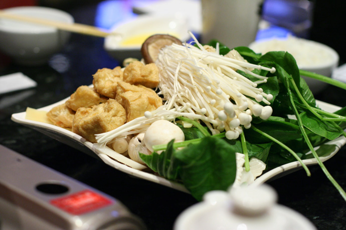 Vegetarian hot pot ingredients from Posh in Vancouver. Mushrooms, spinach, tofu.