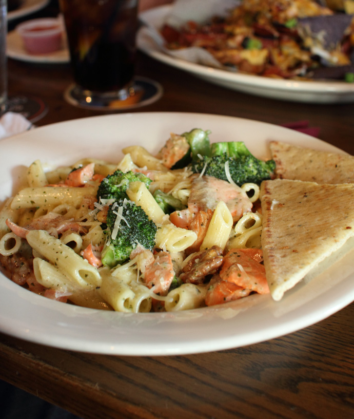 Salmon pesto penne pasta from Rosie's on Robson, restaurant in downtown Vancouver BC Canada.