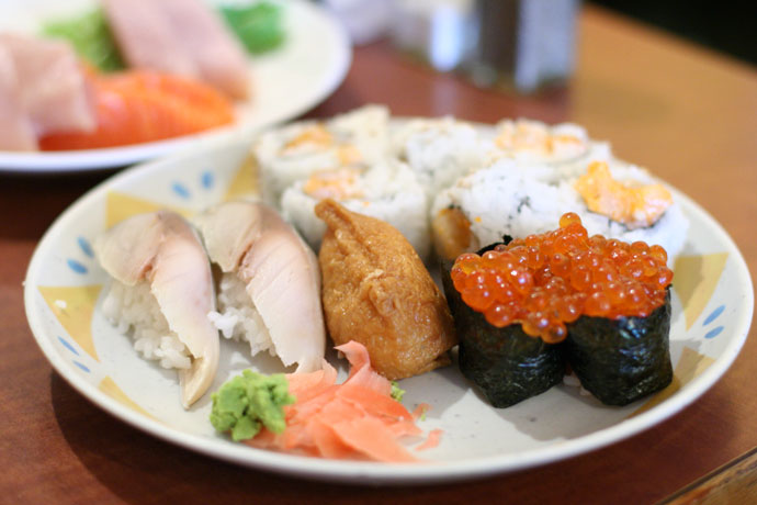 Saba nigiri sushi (Mackerel, $0.99 each), Inari sushi (sweet bean curd wrapper, $0.99) and Ikura sushi.