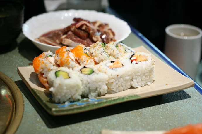 Meat for barbecuing (cook at your table), and sushi: Alaska roll, and Avocado Roll from Shabusen Restaurant in Vancouver.