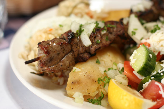 A closeup shot of the Lamb Souvlaki from Simpatico Greek Restaurant in Kitsilano, Vancouver.