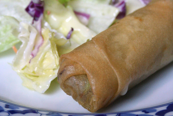 Thai salad with a creamy dressing and a Thai salad roll.