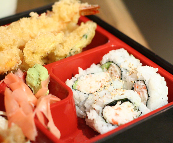 Japanese Bento Box, California roll sushi and prawn and yam tempura.